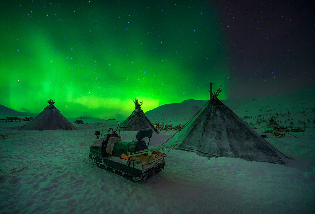 Northern lights at the nomadic reindeer herders camp. Polar Urals, Yamalo-Nenets autonomous okrug, Siberia, Russia