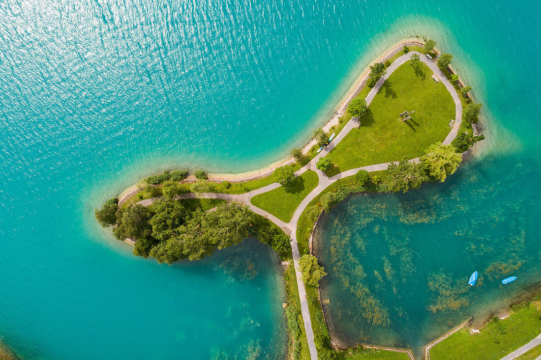 Aerial view of Lake Lungern with a small island in summer, Obwalden, Switzerland.