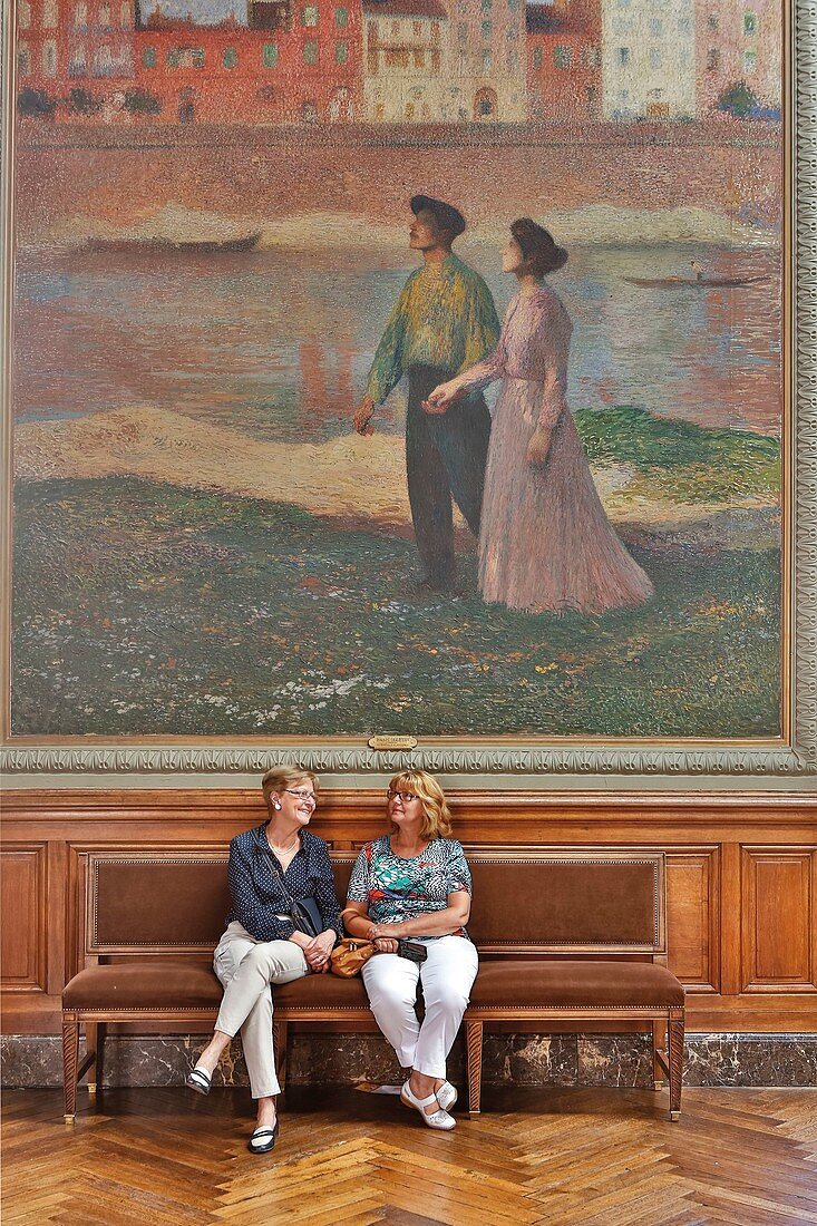 France, Haute Garonne, Toulouse, listed at Great Tourist Sites in Midi-Pyrenees, Capitole Place, Le Capitole, Henri Martin Hall, visiting seated before a painting by Henri Martin