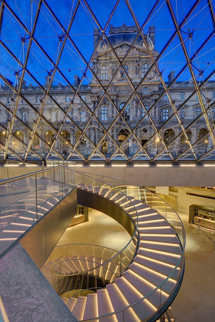 France, Paris, area listed as World Heritage by UNESCO, Louvre museum, the pyramid by architect I.M. Pei and the circular staircase