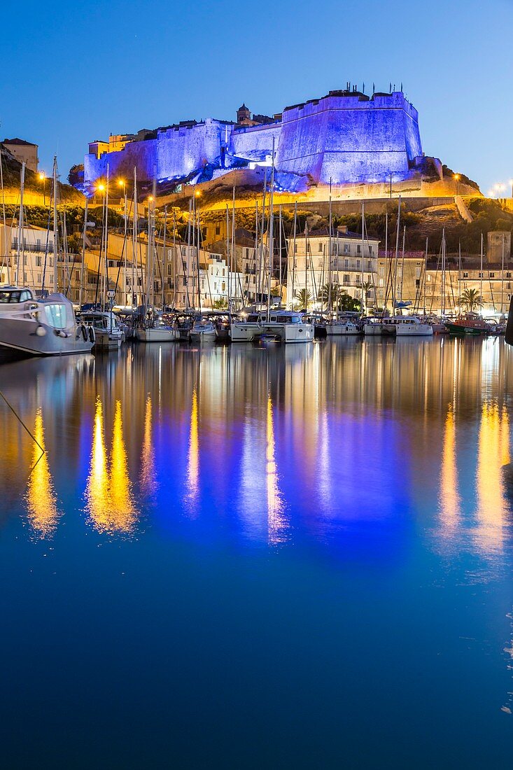 France, South Corsica, Bonifacio, the ramparts of the citadel floodlit seen since the port of the low city