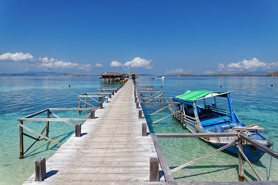Island romance on the Kanawa jetty near Komodo, Flores Island, Sunda Islands, Southeast Asia, Asia