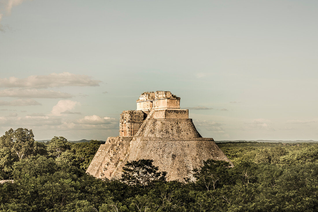 Uxmal, Yucatan, Mexico - October 13, 2017: The Pyramid of the Magician (Pirámide del Mago) towering in the Maya City of Uxmal, Mexico