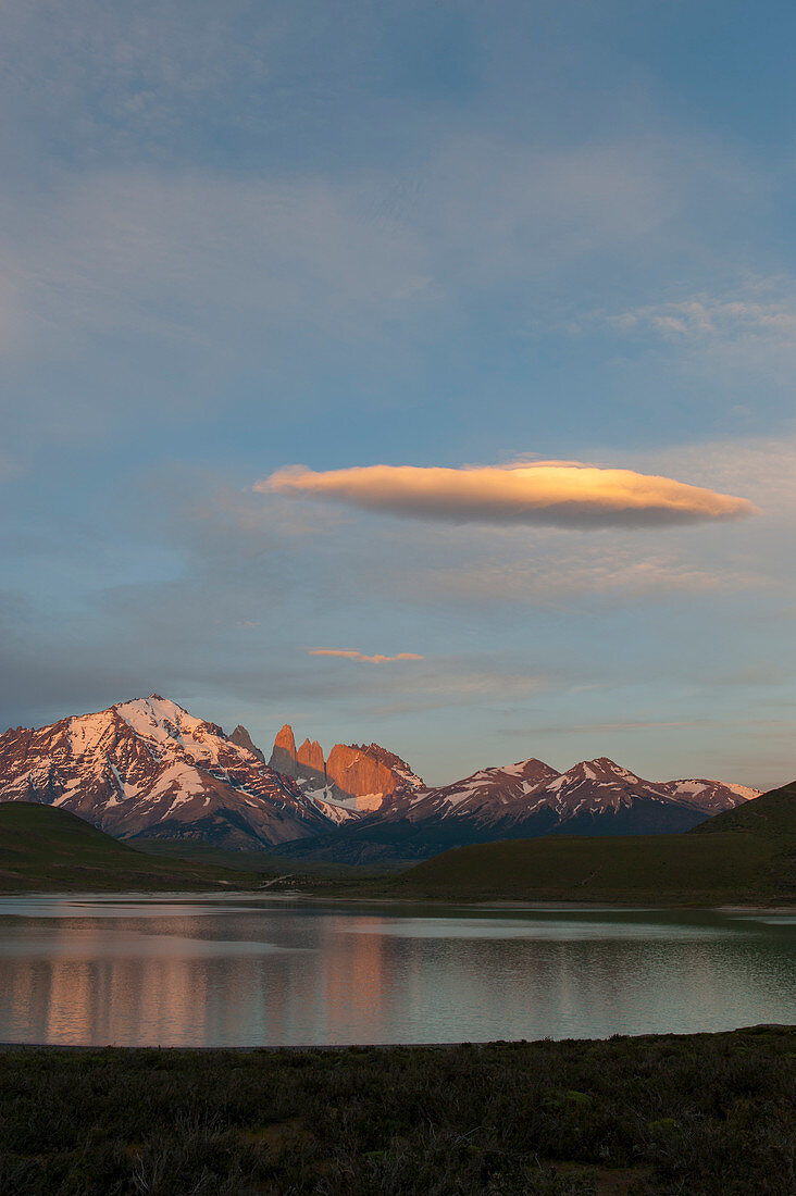 View at sunrise from Laguna Amarga of Almirante Nieto Mountain and the Paine Towers in Torres del Paine National Park in Patagonia, Chile.