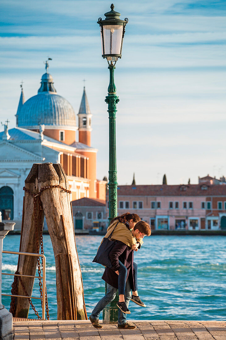 Couple walking at Zattere, Dorsoduro, Venice, Veneto, Italy