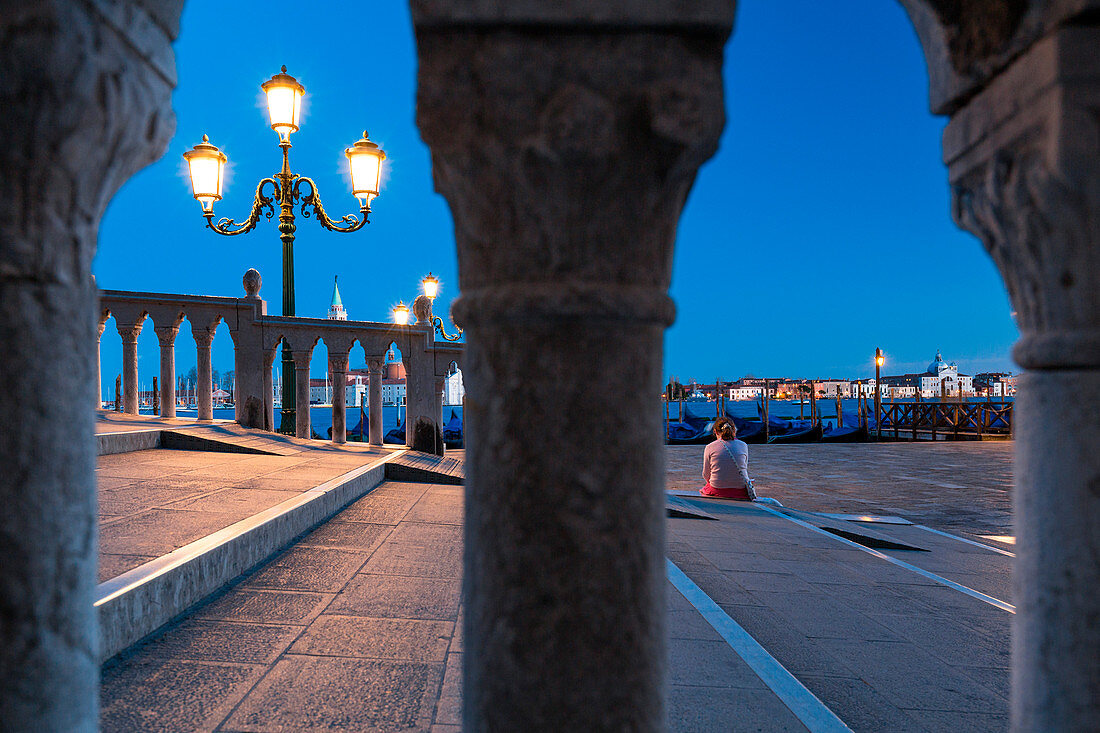 Woman at Ponte della Paglia at dusk, Venice, Veneto, Italy 