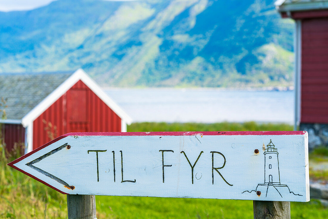 Wood signage showing directions for Hogsteinen Lighthouse, Godoya Island, Alesund, More og Romsdal County, Norway