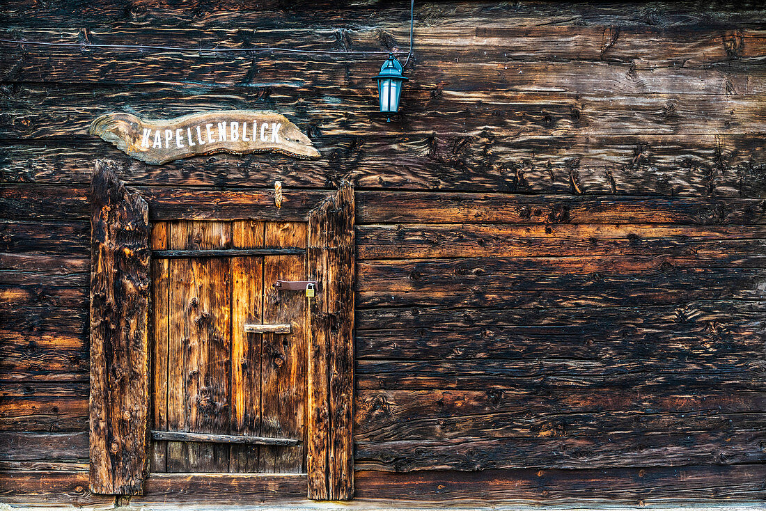 Wood facade and doorway of alpine chalet, Bettmeralp, canton of Valais, Switzerland