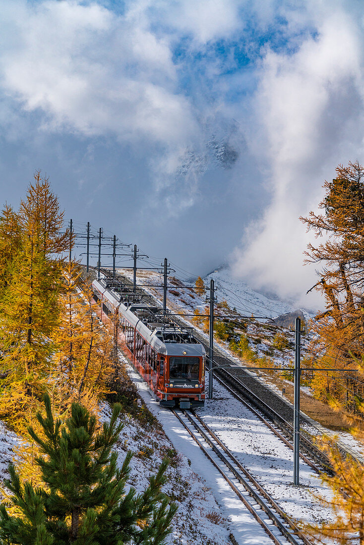 Gornergrat Bahn train in the autumnal landscape, Zermatt, canton of Valais, Switzerland
