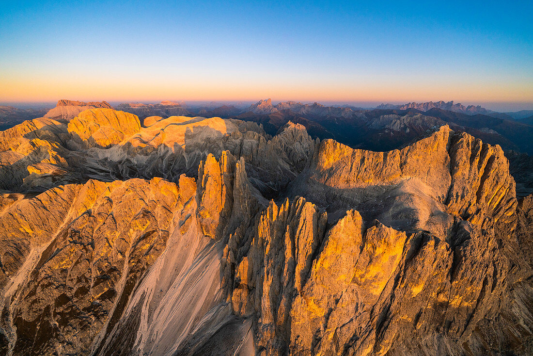 Autumn sunset over Torri Del Vajolet and Catinaccio, Catinaccio Group, aerial view, Dolomites, South Tyrol, Italy