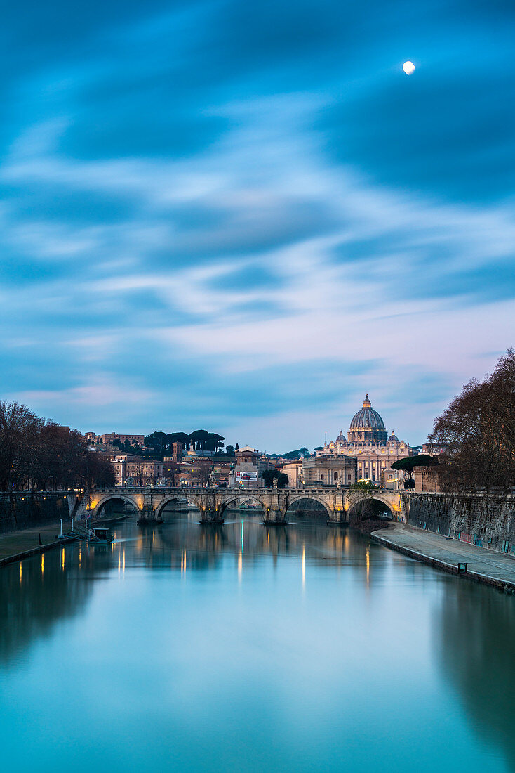 Sunrise on river Tiber with bridge Umberto I and St. Peter's Basilica (Basilica di San Pietro) in background, Rome, Lazio, Italy