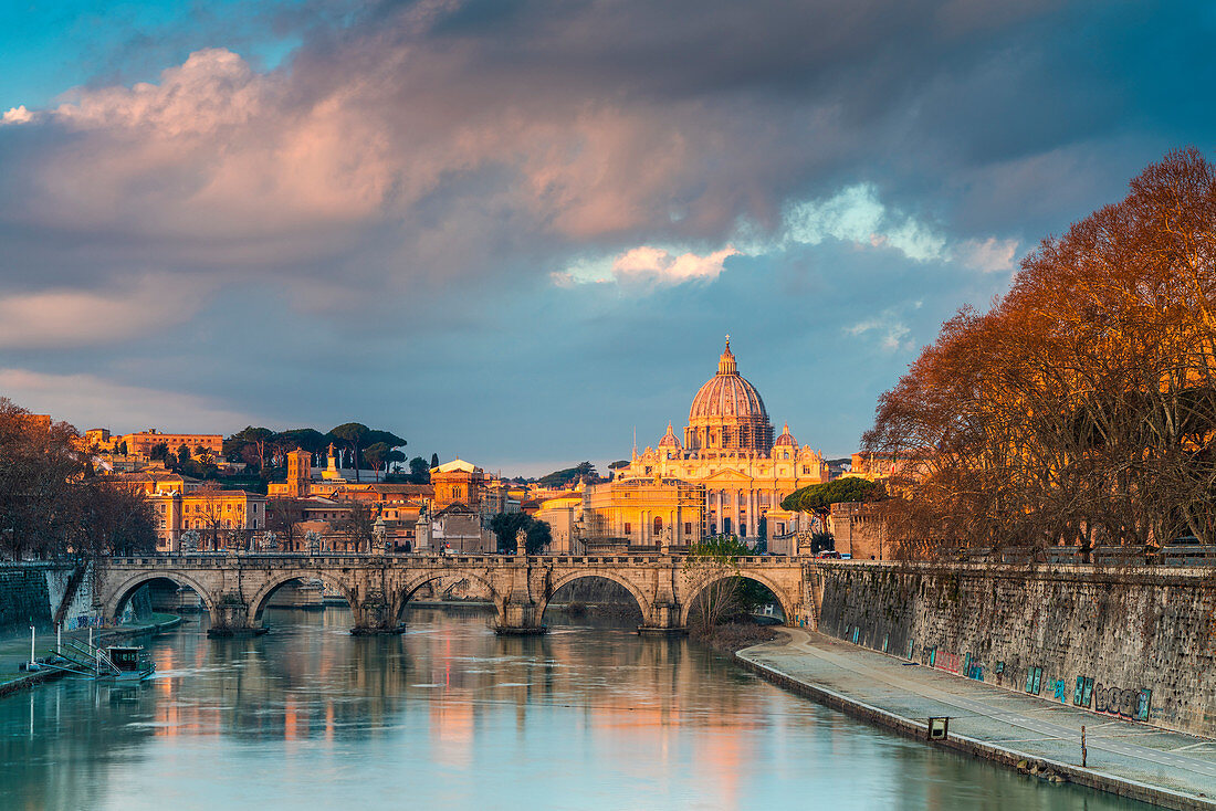 River Tiber and St. Peter's Basilica (Basilica di San Pietro) at sunrise, Rome, Lazio, Italy