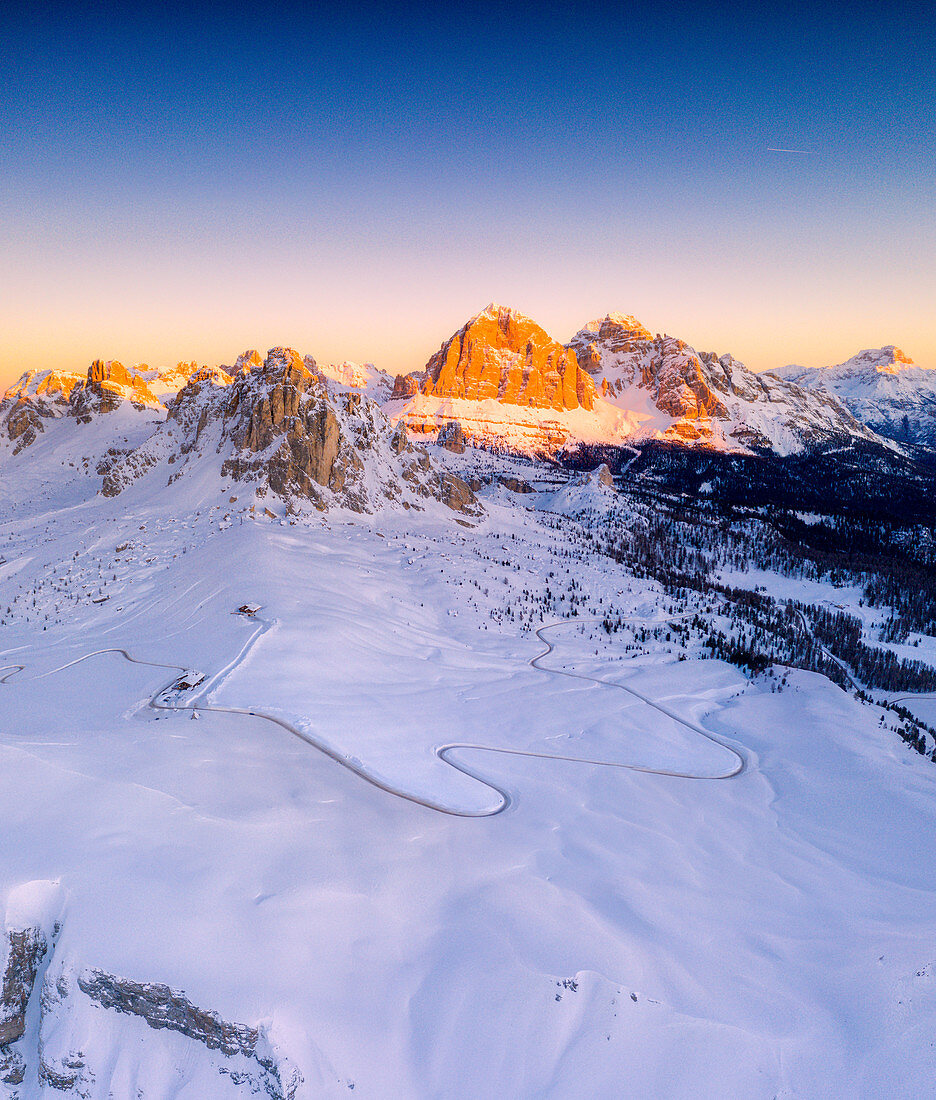 Panoramic of snow capped Ra Gusela, Nuvolau, Averau and Tofane at sunrise, aerial view, Giau Pass, Dolomites, Veneto, Italy