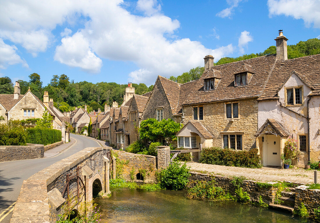 Water Lane with bridge over By Brook on to The Street, Castle Combe village, Castle Combe, Cotswolds, Wiltshire, England, United Kingdom, Europe