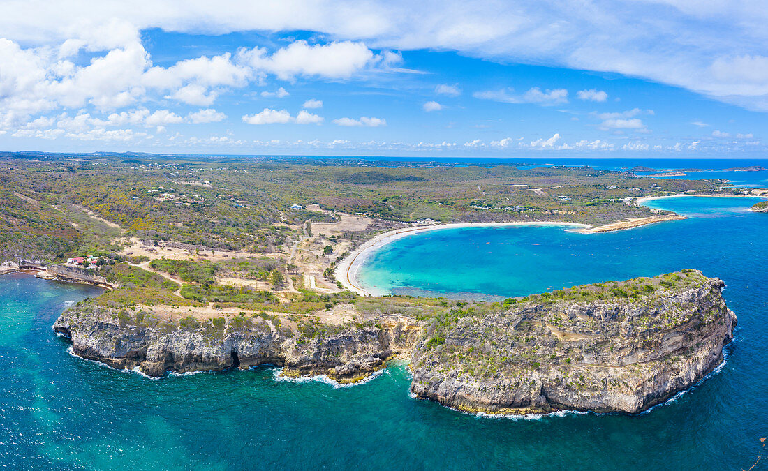 Aerial panoramic by drone of cliffs surrounding Half Moon Bay washed by Caribbean Sea, Antigua, Leeward Islands, West Indies, Caribbean, Central America