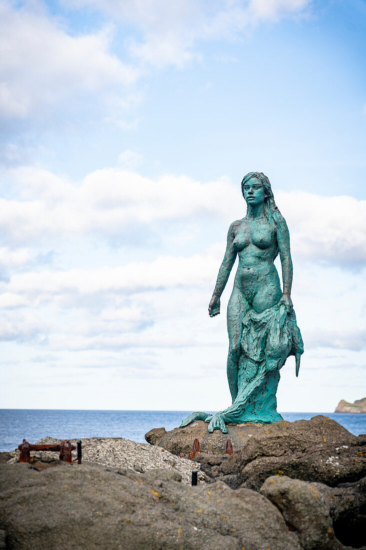 Bronze statue of the seal woman created by Hans Pauli Olsen, based on the folk tale in which the village of Mikladalur was cursed, Mikladalur, Kalsoy, Faroe Islands, Denmark.