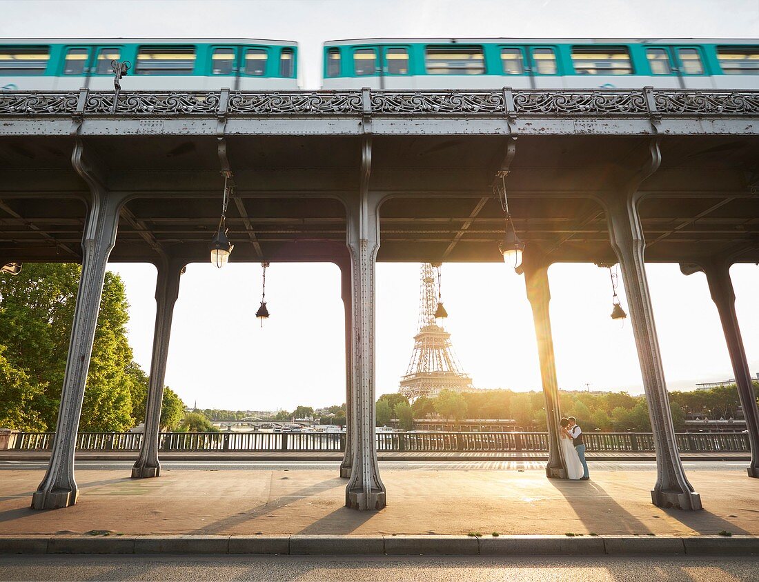 France, Paris, Paris, a recently married couple kiss each other on the Bir hakeim bridge