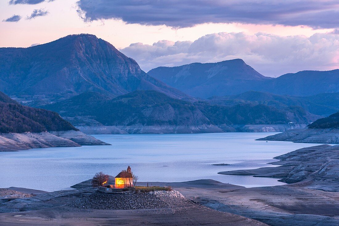 France, Hautes-Alpes, the lake of Serre-Ponçon, at an abnormally low level, extremely rare phenomenon related to the weather of this winter 2018, Saint-Michel chapel on Saint-Michel islet