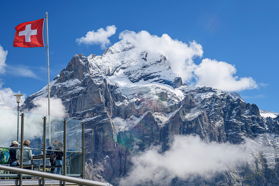 Several people on the terrace at First with a view of Wetterhorn, First, Grindelwald, Bernese Oberland, UNESCO World Natural Heritage Swiss Alps Jungfrau-Aletsch, Bernese Alps, Bern, Switzerland