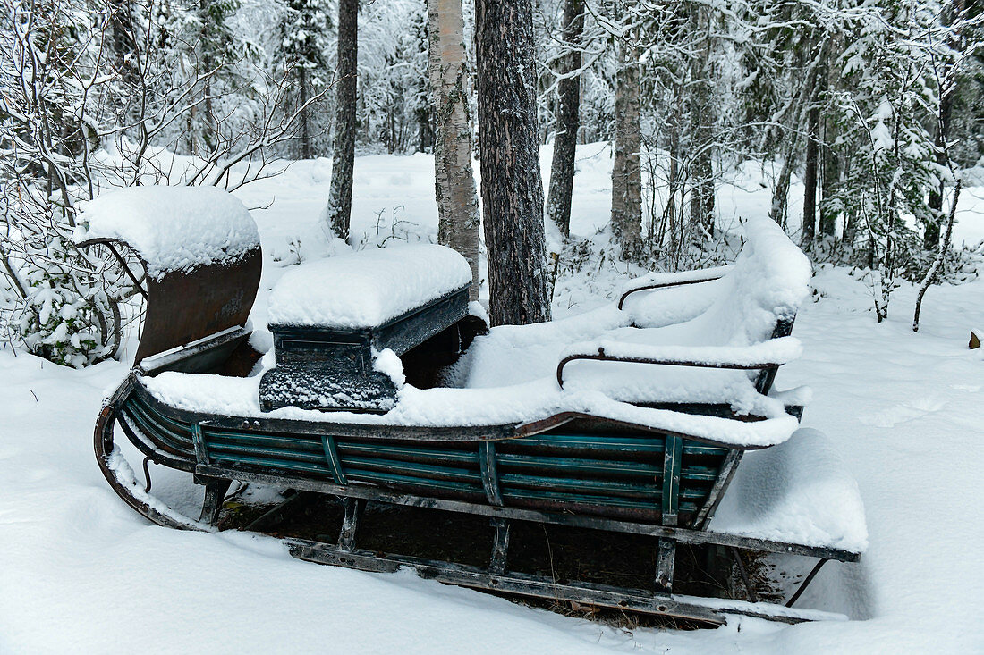 Old sleigh in deep snow, Malå, Lapland, Sweden