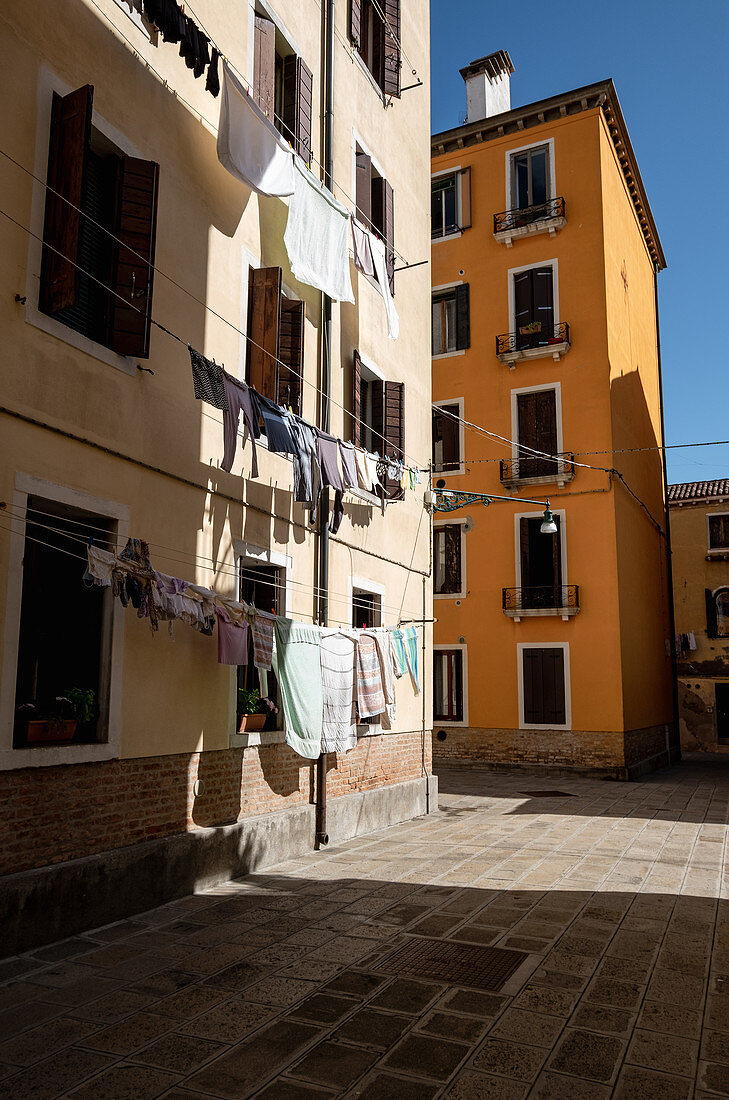 View of house facades with clotheslines in Cannaregio, Venice, Veneto, Italy, Europe