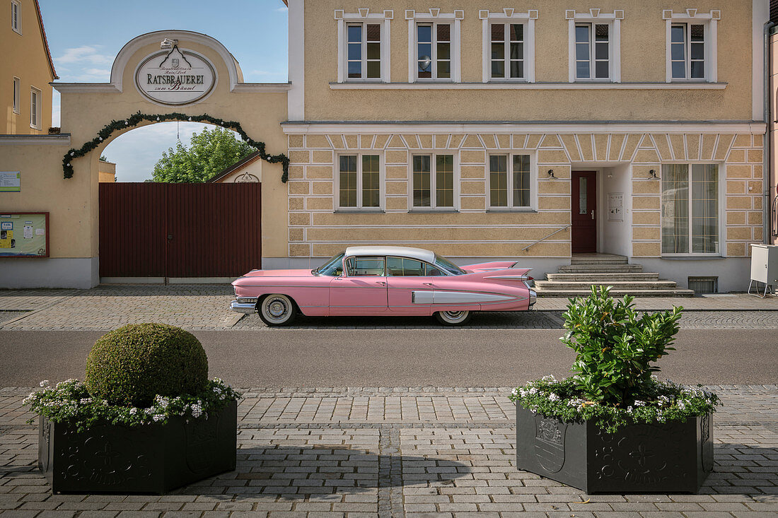 pink red American vintage car parked in front of brewery, Rain am Lech, Donau-Ries district, Bavaria, Danube, Germany