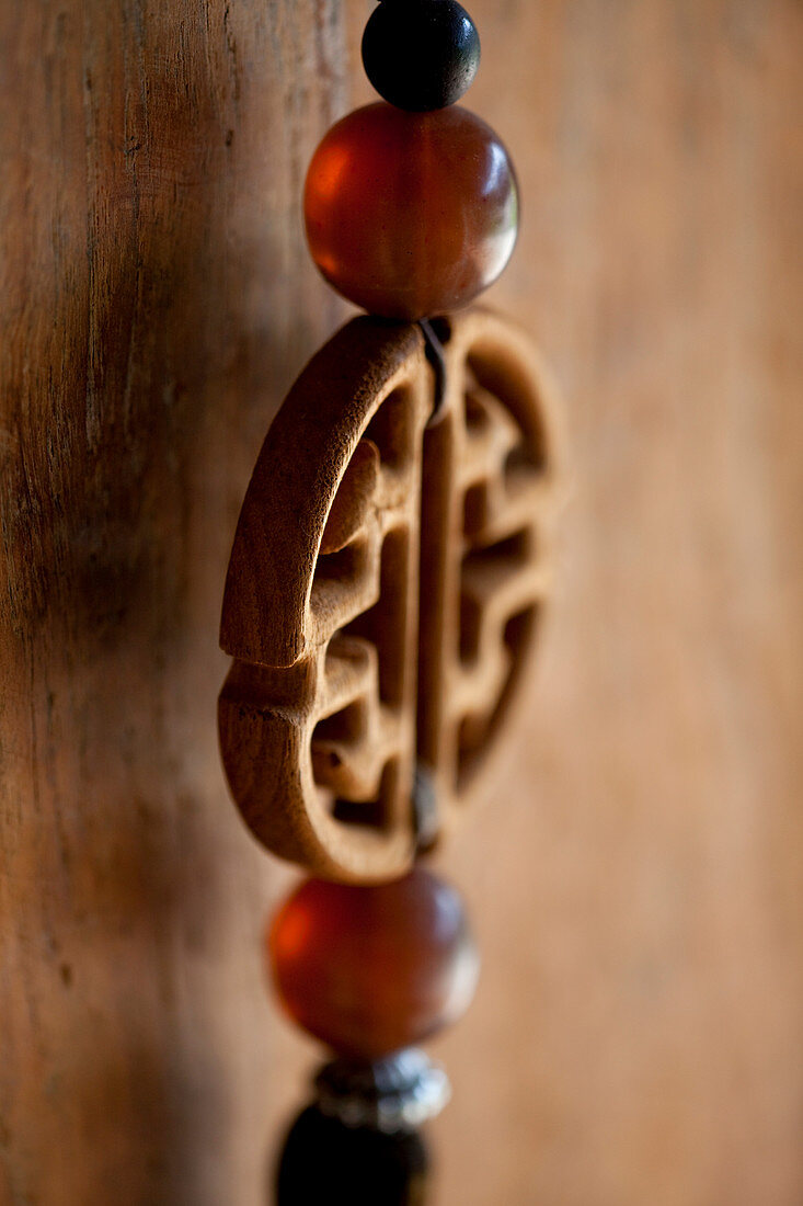 Detail shot of a Chinese, decorative key chain. Bali, Indonesia.