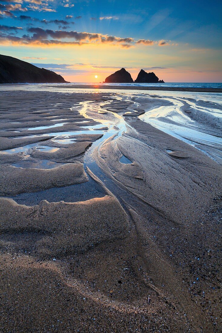 Sunset captured in March from the beach at Holywell Bay on the North Coast of Cornwall.  The image was carefully composed to make the most of the pool's of water on the beach.