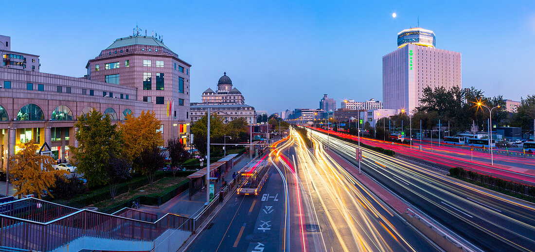 Traffic trail lights on major road near Beijing Zoo at dusk, Beijing, People's Republic of China, Asia