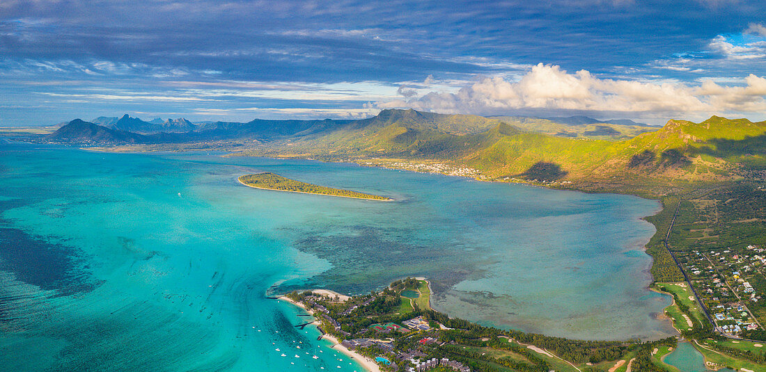 Aerial panoramic of turquoise lagoon surrounding Aux Benitiers and La Gaulette, Le Morne Brabant, Mauritius, Indian Ocean, Africa