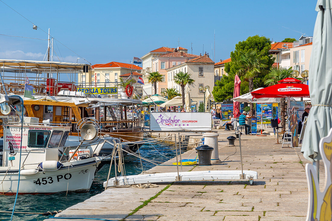 View of boats and buildings in the harbour of the Old Town of Porec and Adriatic Sea, Porec, Istria, Region, Croatia, Europe