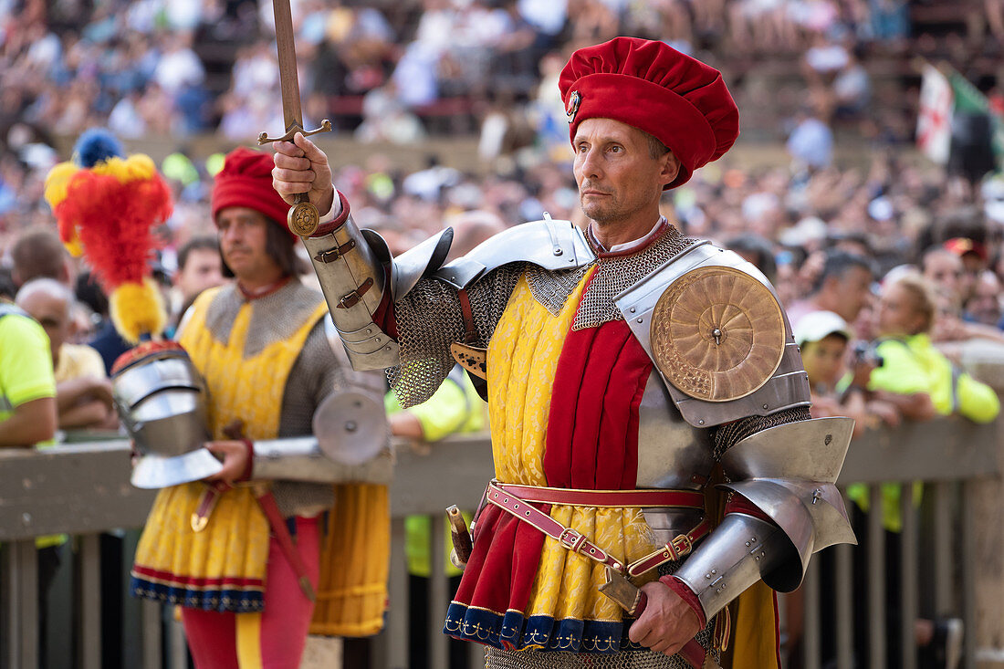 At the pageant that precedes the Palio race, representatives of each neighbourhood parade in traditional costume, Siena, Tuscany, Italy, Europe