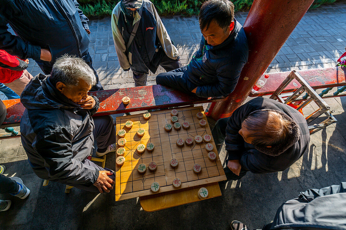 Locals playing board game in Gathering at the Ghost Corridor in the Temple of Heaven, Beijing, People's Republic of China, Asia