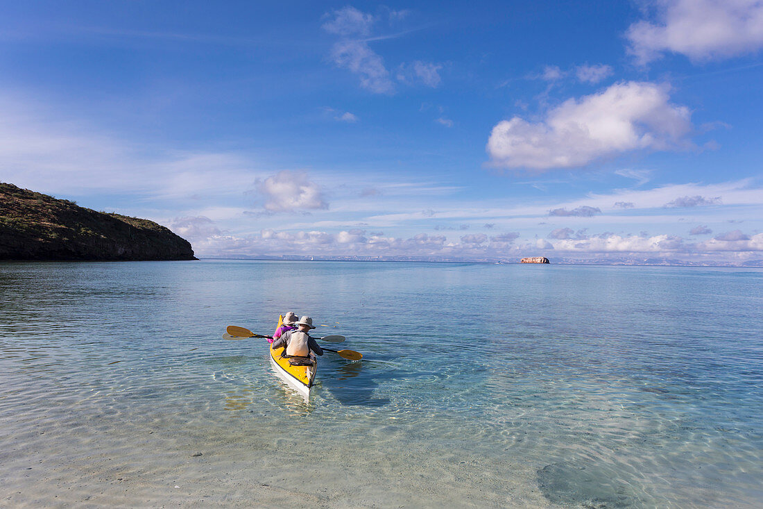 Couple in a kayak, paddling on the Sea of Cortes