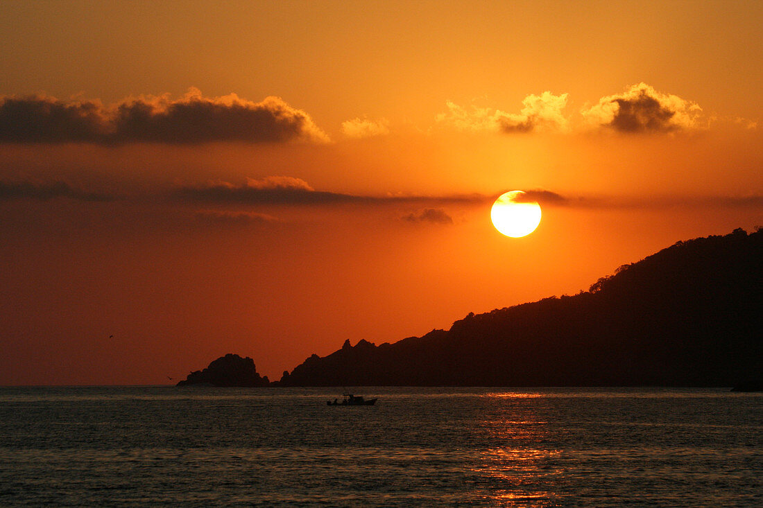 An orange sunset in Zihuatanejo, Mexico