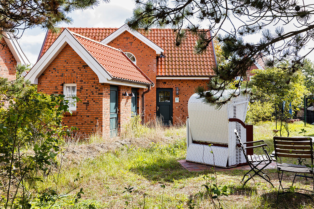 Typical island house with garden, beach chair, brick, grass, Spiekeroog, East Frisia, Lower Saxony, Germany
