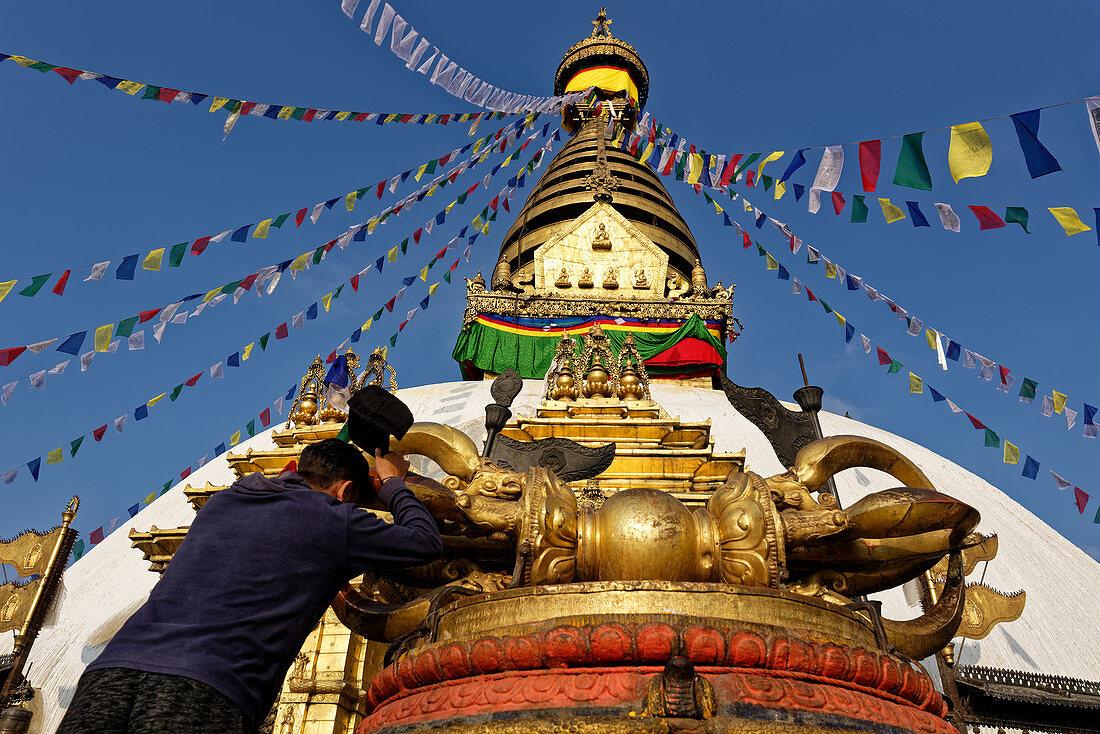 Pilgrims in front of the stupa of Swayambhunath, Kathmandu, Nepal, Asia.