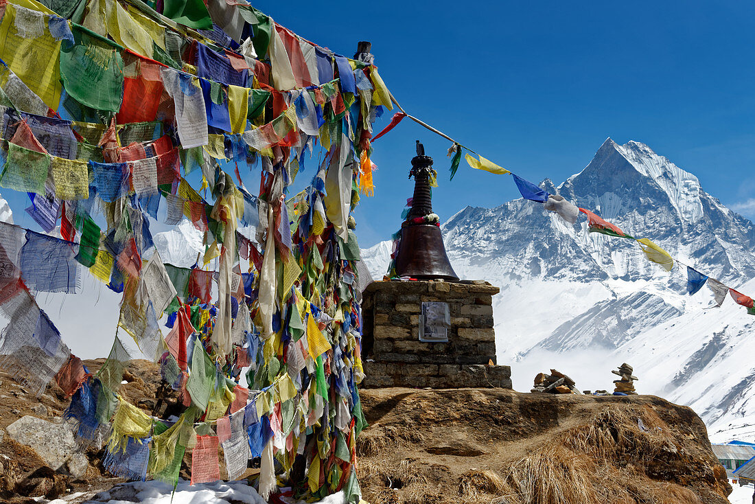 Buddhist prayer flags above Annapurna Base Camp, Nepal, Himalayas, Asia.