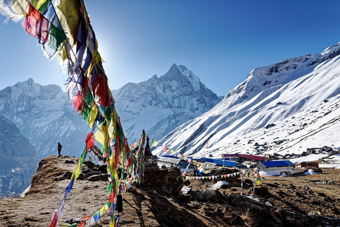 Buddhist prayer flags above Annapurna Base Camp, Nepal, Himalayas, Asia.