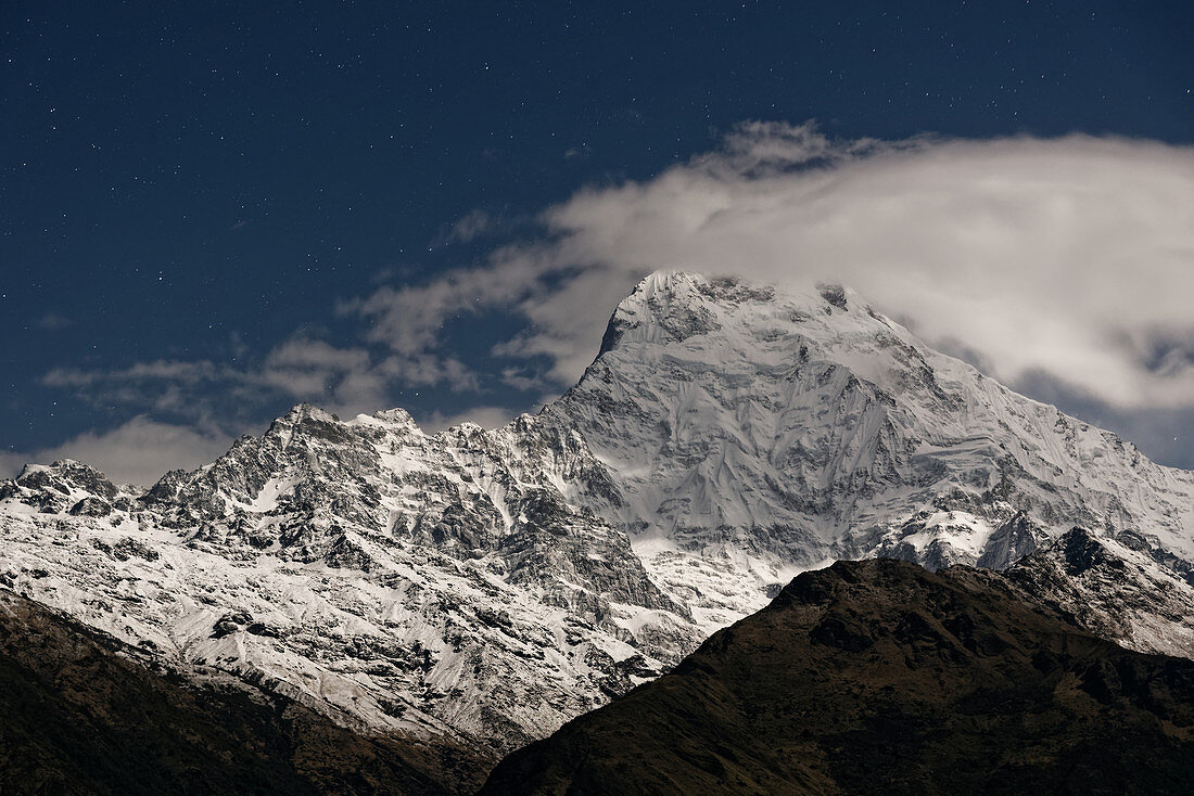 Full moonlight on the Annapurna South, Nepal, Himalayas, Asia.