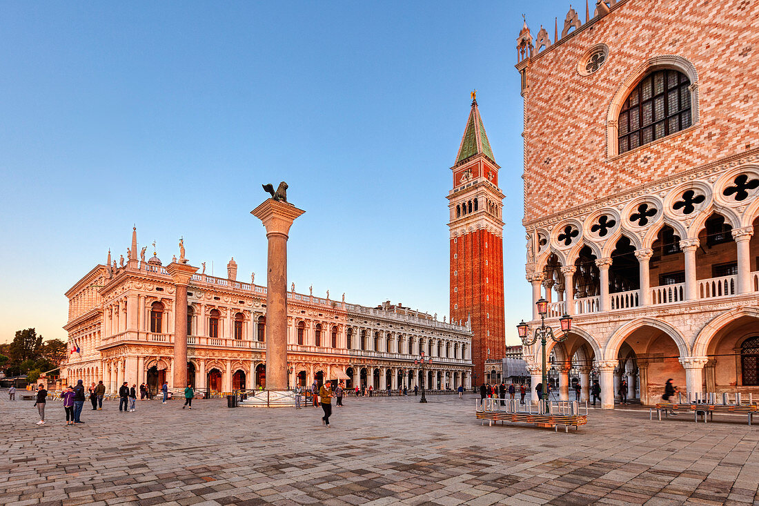 Palazzo Ducale (right), San Marco Tower and National Library (left) at sunrise in Venice, Veneto, Italy