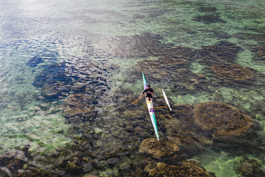 Aerial view of outrigger canoe in the Moorea Lagoon, Avamotu, Moorea, Windward Islands, French Polynesia, South Pacific
