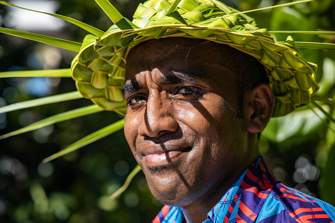 Friendly waiter with pandani hat at Malamala Island Beach Club, Mala Mala Island, Mamanuca Group, Fiji Islands, South Pacific