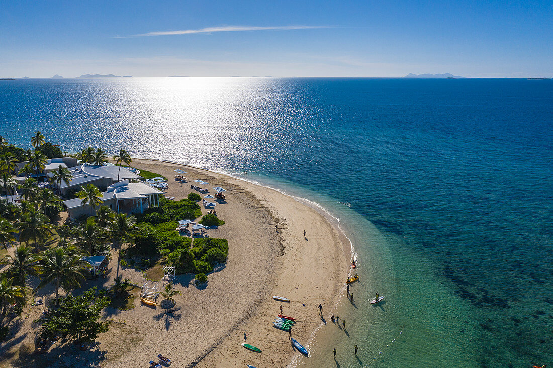 Aerial view of people enjoying water sports activities at Malamala Island Beach Club, Mala Mala Island, Mamanuca Group, Fiji Islands, South Pacific