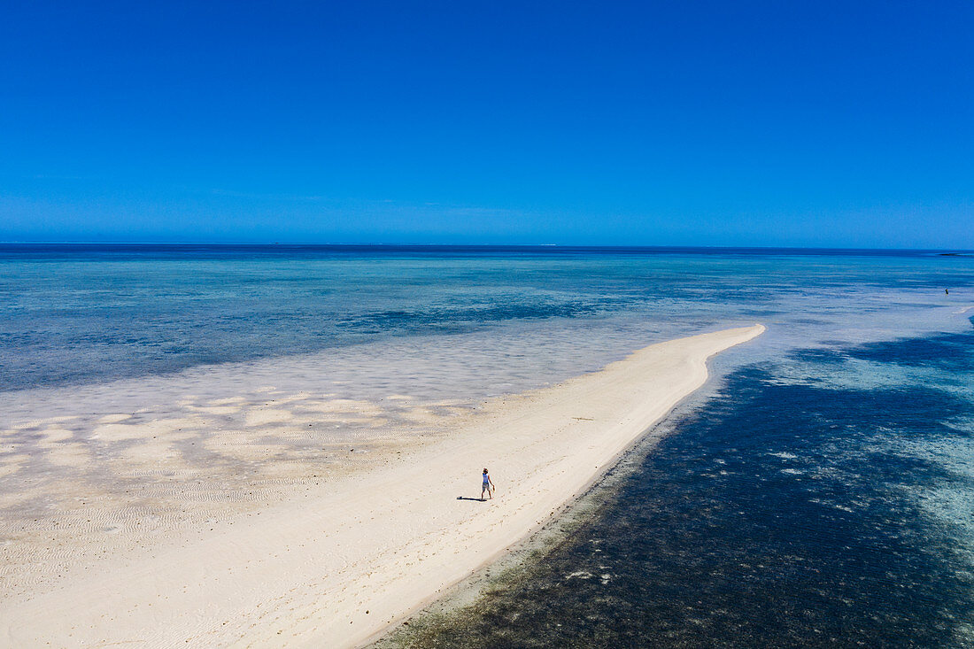Aerial view of woman alone on sandbar during a boat trip from Six Senses Fiji Resort, Malolo Island, Mamanuca Group, Fiji Islands, South Pacific