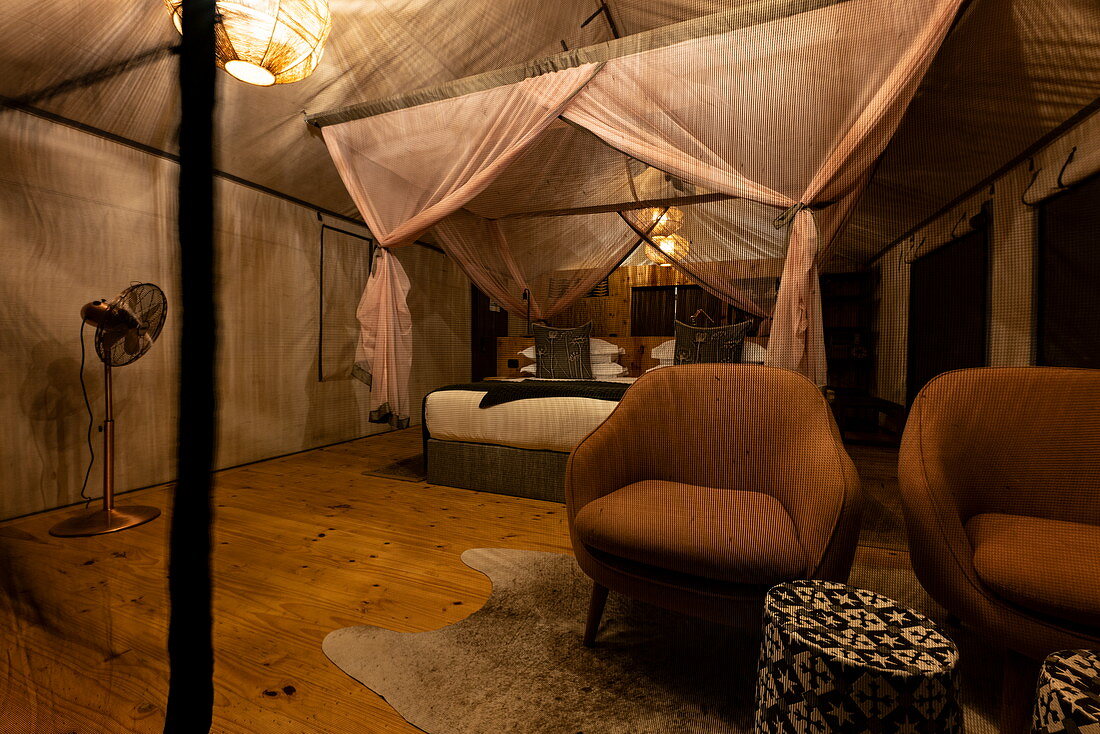 Interior of a luxury tent accommodation in the luxury resort tented camp Magashi Camp (Wilderness Safaris), Akagera National Park, Eastern Province, Rwanda, Africa