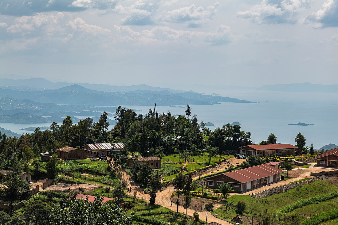 Buildings on hillside with Lake Kivu behind, near Gitesi, Western Province, Rwanda, Africa