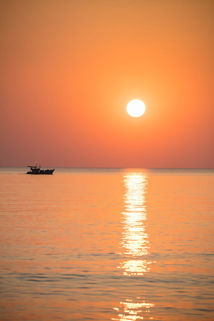 Silhouette of fishing boat at sunset, Ong Lang, Phu Quoc Island, Kien Giang, Vietnam, Asia