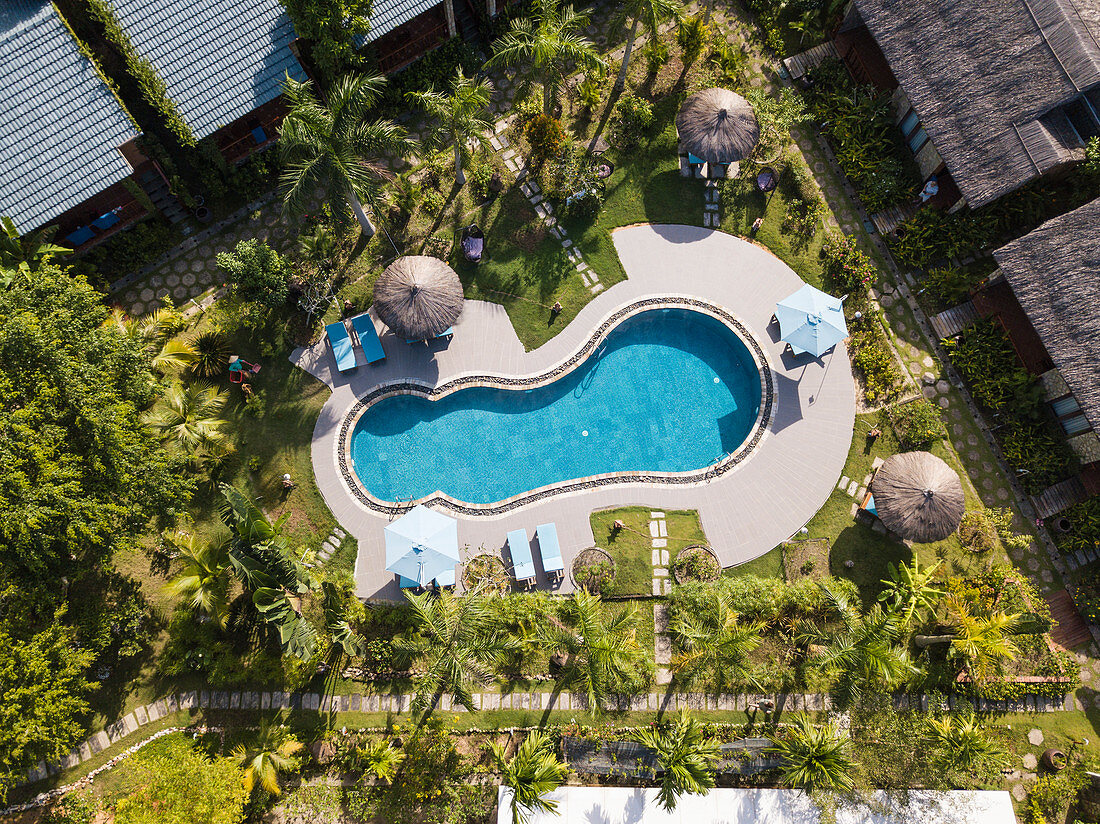Aerial view of swimming pool in the garden of Cottage Village Phu Quoc Resort near Ong Lang Beach, Ong Lang, Phu Quoc Island, Kien Giang, Vietnam, Asia