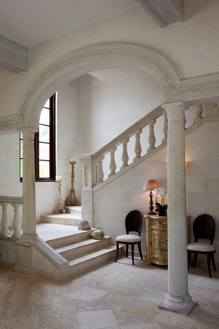 Interior shot of a white, sandstone hallway of a colonial style home in Antigua.